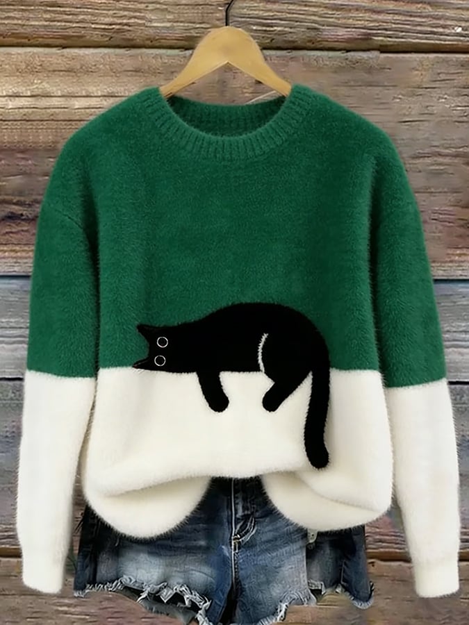 Green two tone knit jumper with a black cat lying across the middle