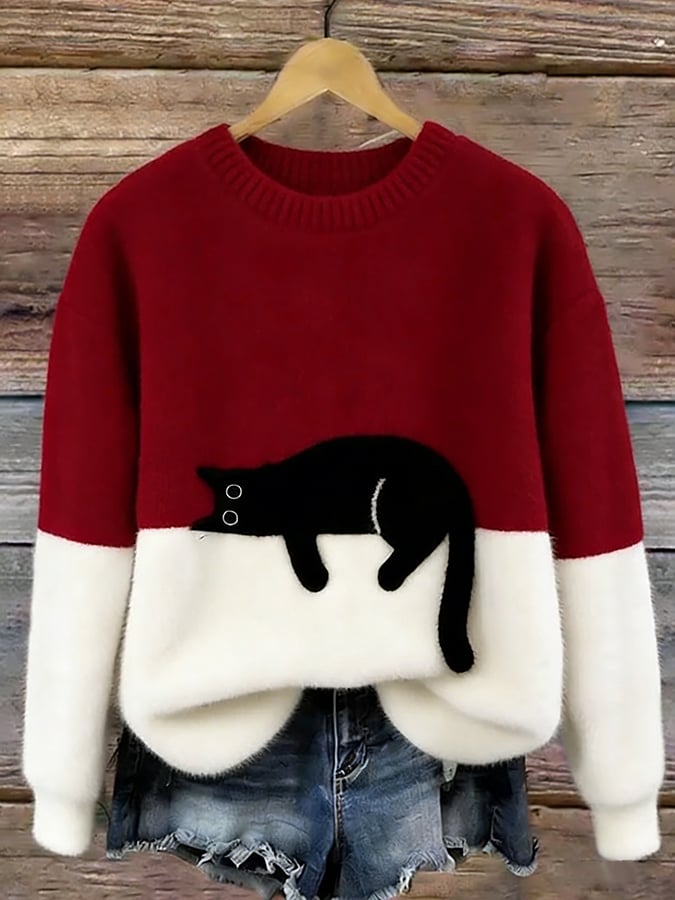 Red colour block jumper on a hanger with black cat motif