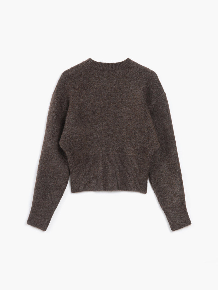Brown crew neck jumper laid flat with ribbed cuffs
