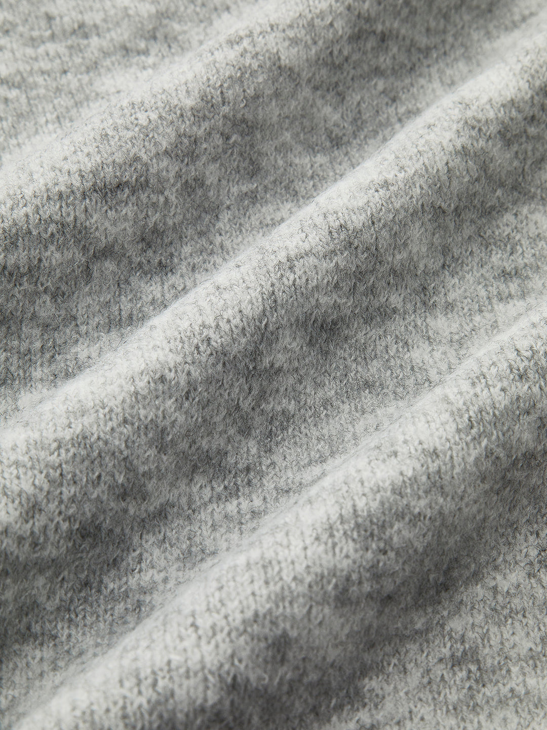 Fluffy grey knit fabric in close up