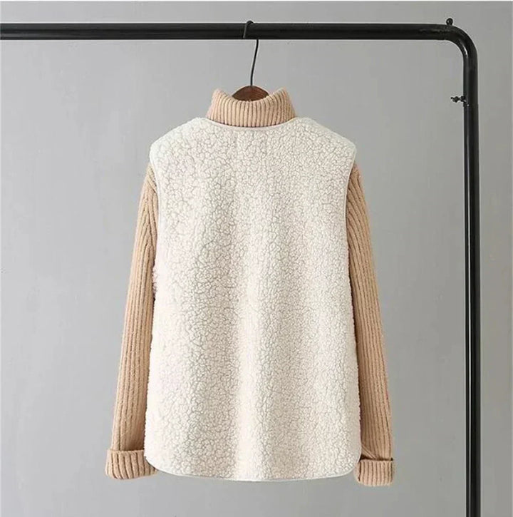 Beige gilet seen from the back on a clothes rail