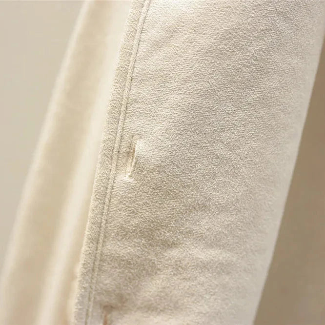 Smooth reverse side of the beige gilet