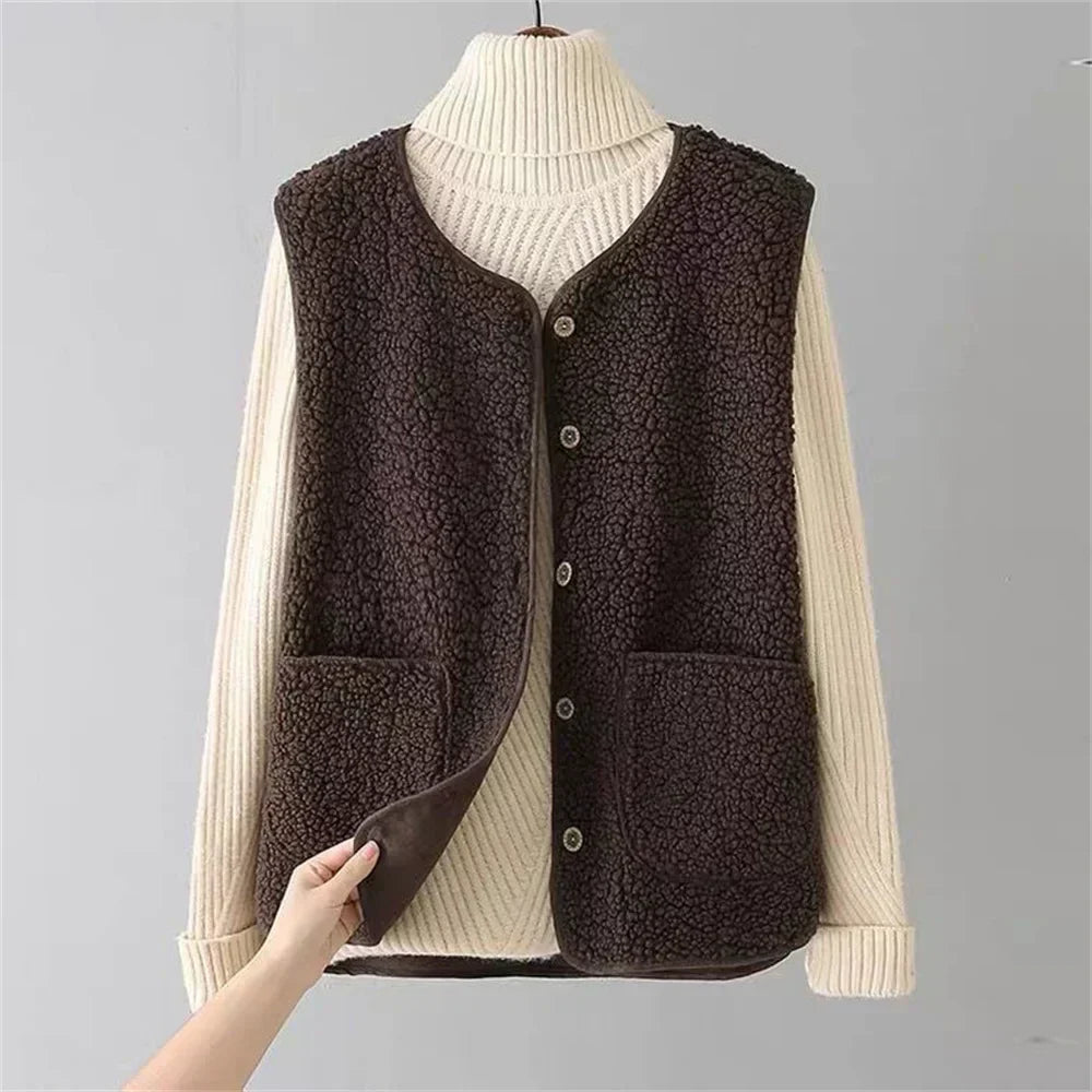 Dark brown teddy gilet buttoned over a cream jumper