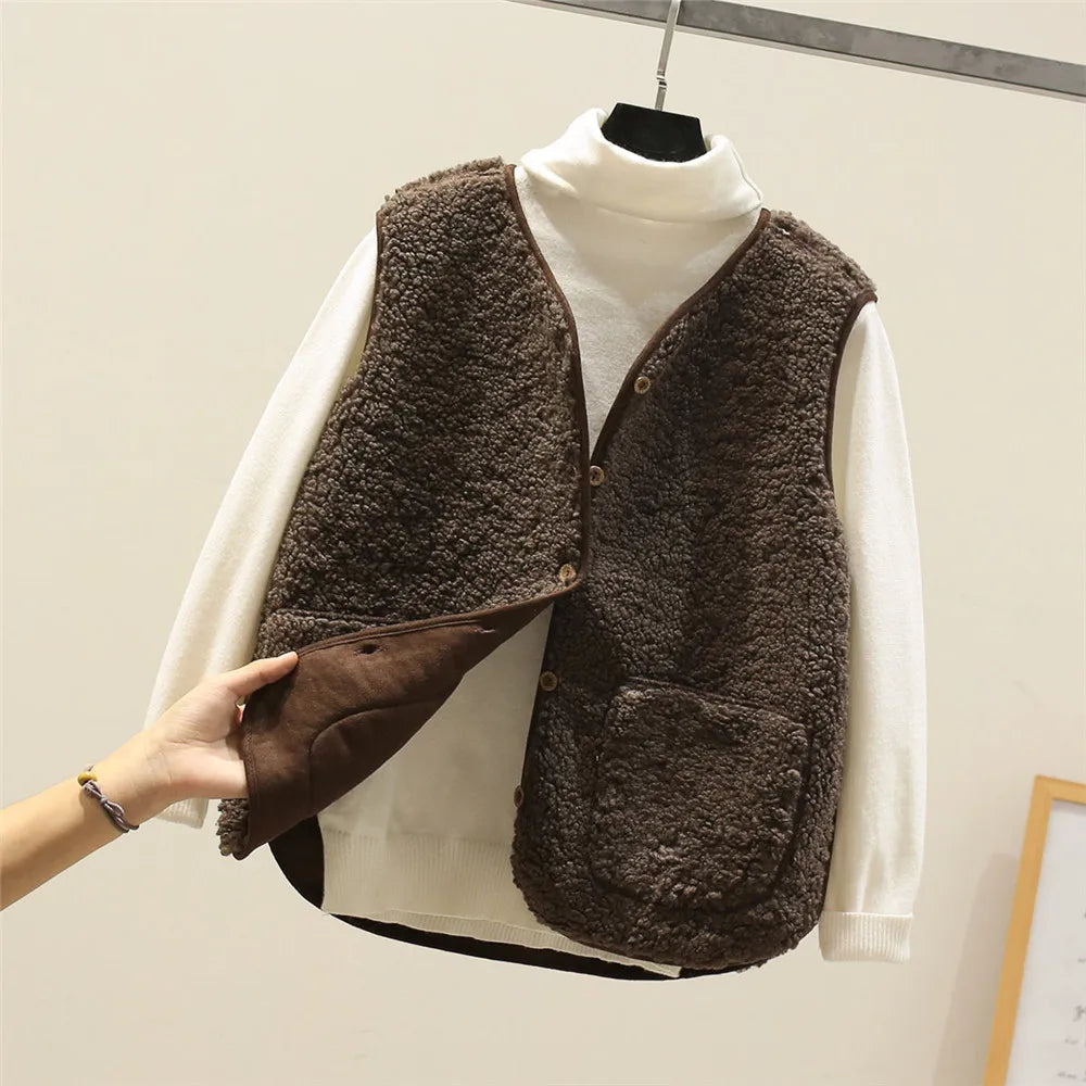 Dark brown teddy gilet with the smooth brown reverse showing