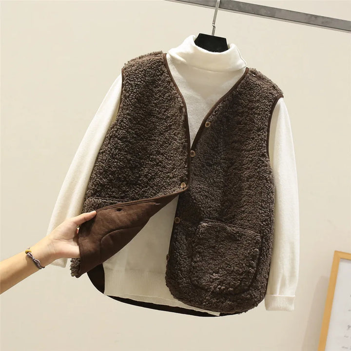 Dark brown teddy gilet with the smooth brown reverse showing