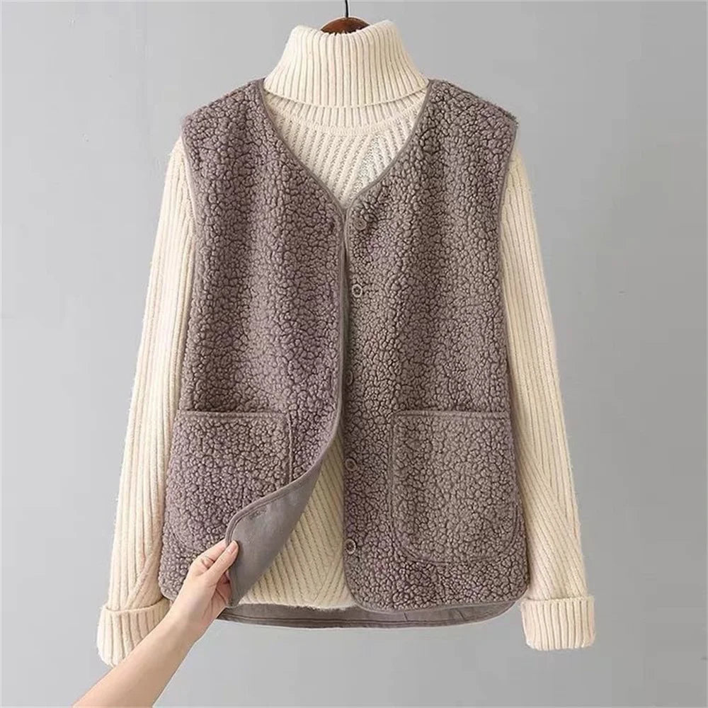 Taupe gilet with V-neck over a cream ribbed jumper