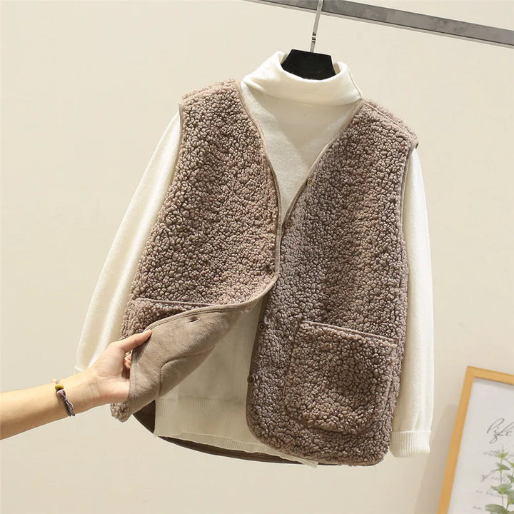 Taupe teddy fleece gilet opened to show the smooth reverse