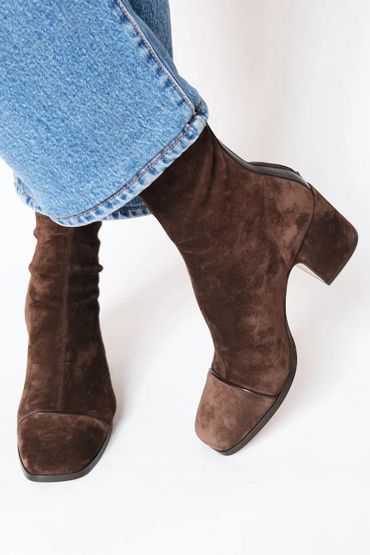 Dark brown square toe ankle boot seen from the side with block heel