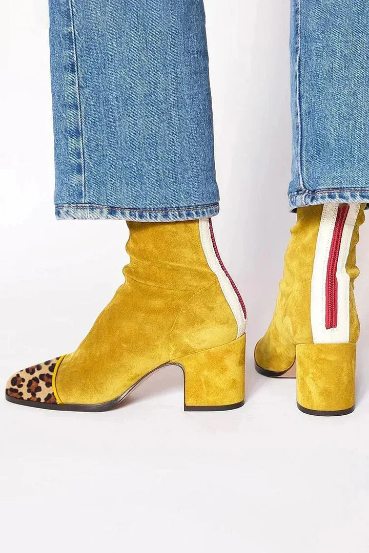 Mustard yellow ankle boots with a leopard print toe cap