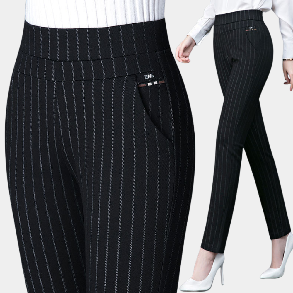 Model in black pinstripe leggings with white heels, full slim leg view