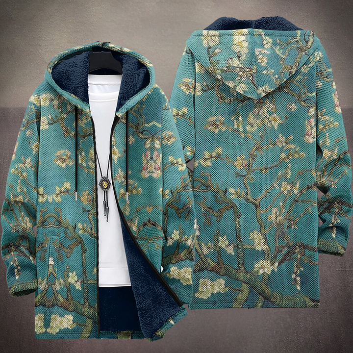 Front and back of the teal blossom jacket, branches continuing over the hood