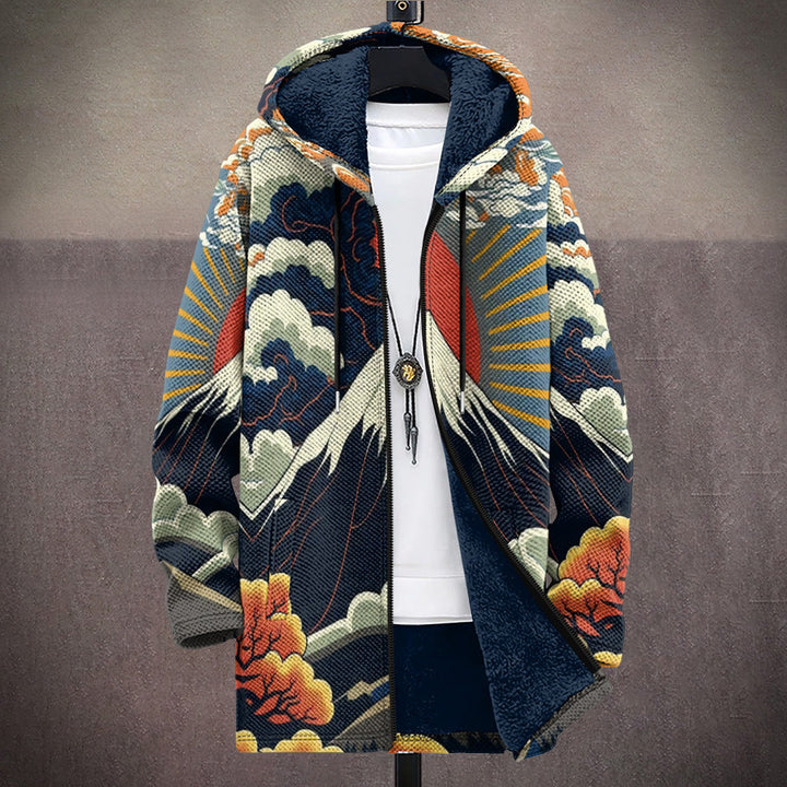 Women's hooded jacket in navy with snowy mountain, red sun and cloud print, worn open