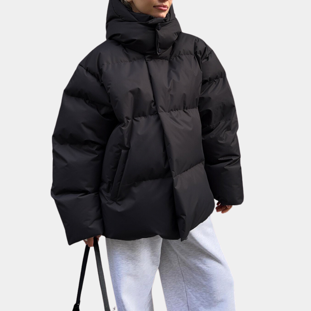 Black puffer jacket with the hood up and side pockets