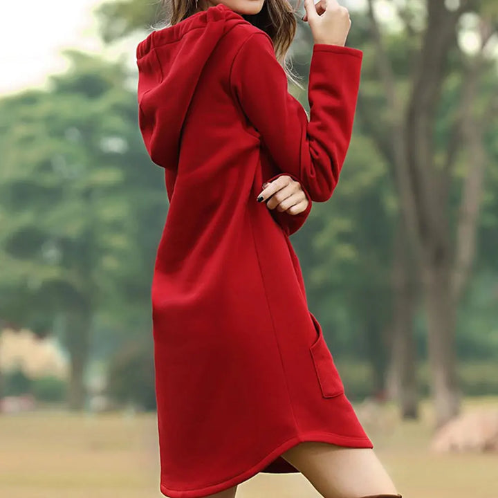 Red hoodie dress side view showing the hood and curved hem