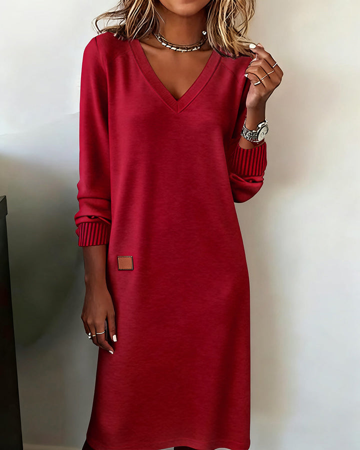 Red V neck jumper dress with a straight relaxed shape