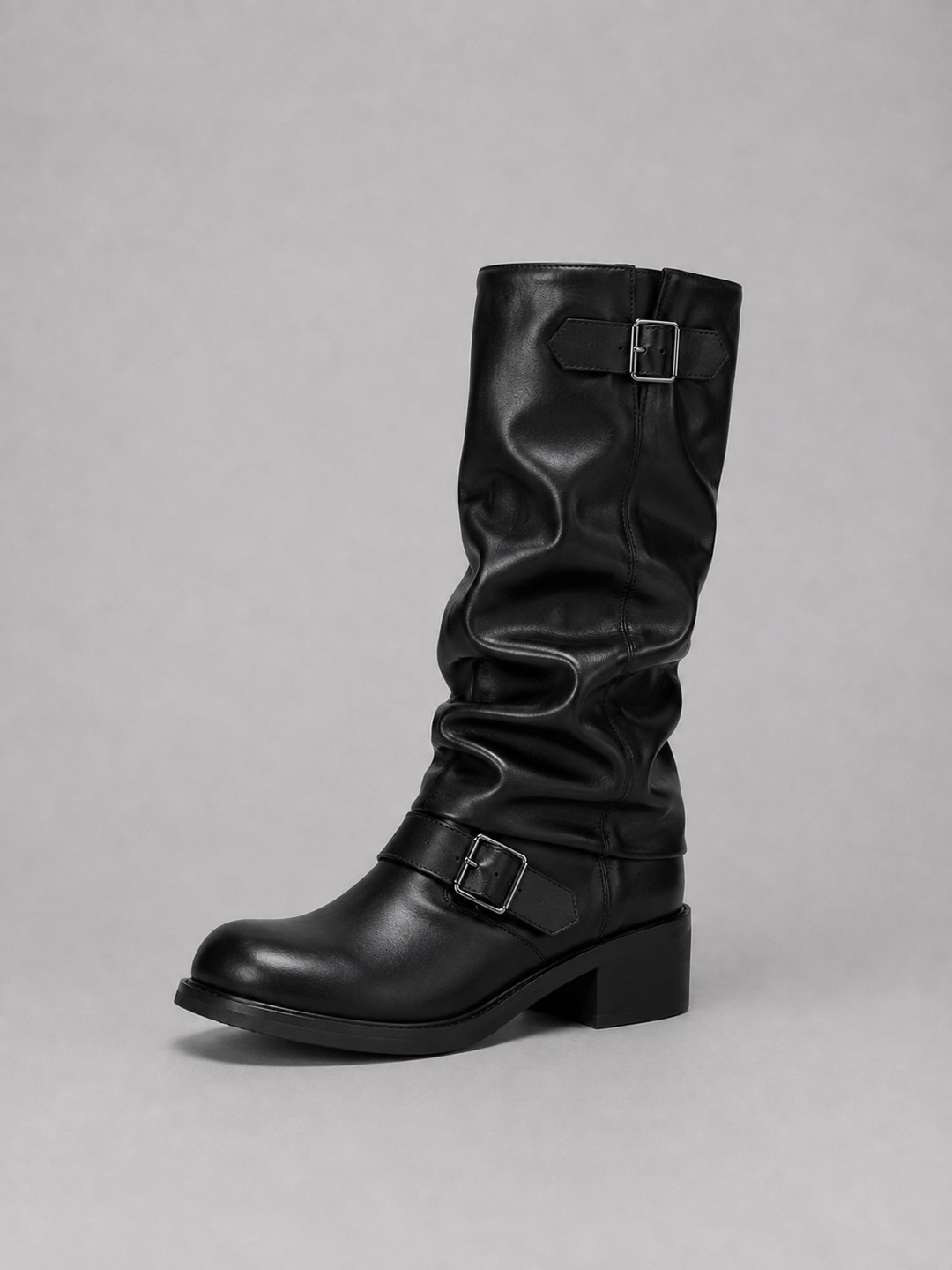 Side view of the black knee high boots