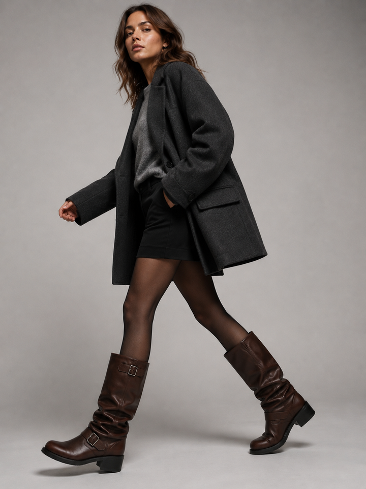 Model wearing the brown knee high boots