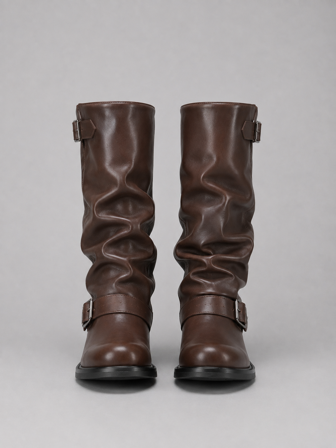 Pair of brown knee high boots seen from the front