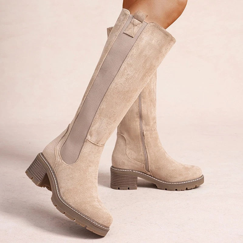 Beige knee high boots, worn on foot, front view