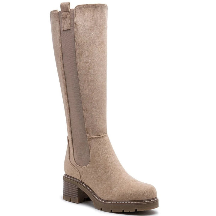 Beige knee high boots, three quarter view on a plain background