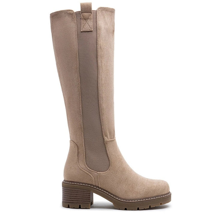 Beige knee high boots, side view on a plain background