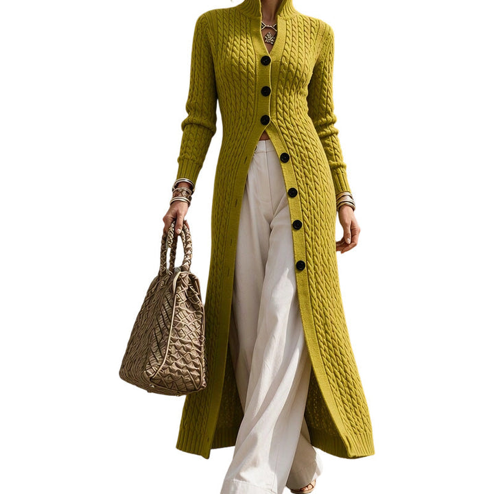 Women's long cardigan in olive green with stand collar and dark buttons, worn with a quilted bag