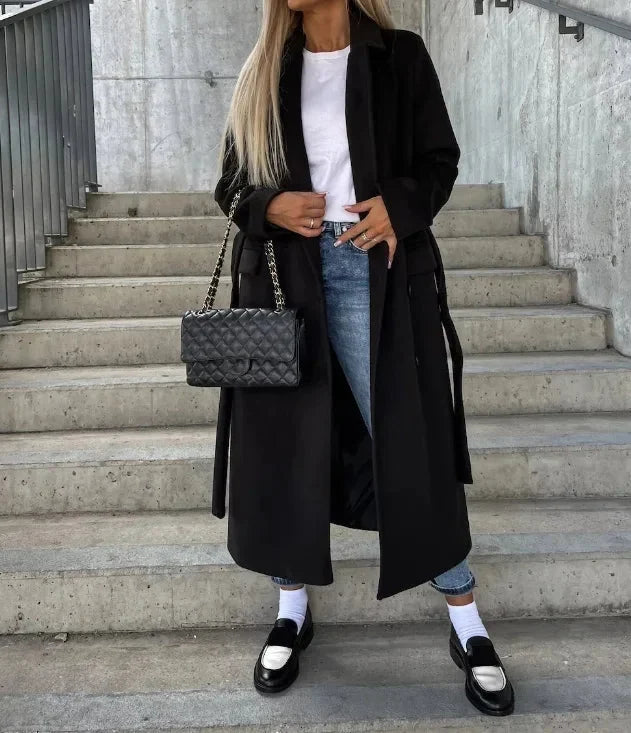 Women's long coat in black, double breasted belted notch lapel