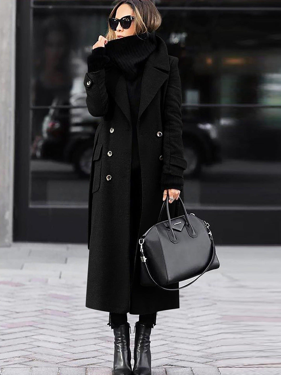 Black full length coat worn with ankle boots in the city