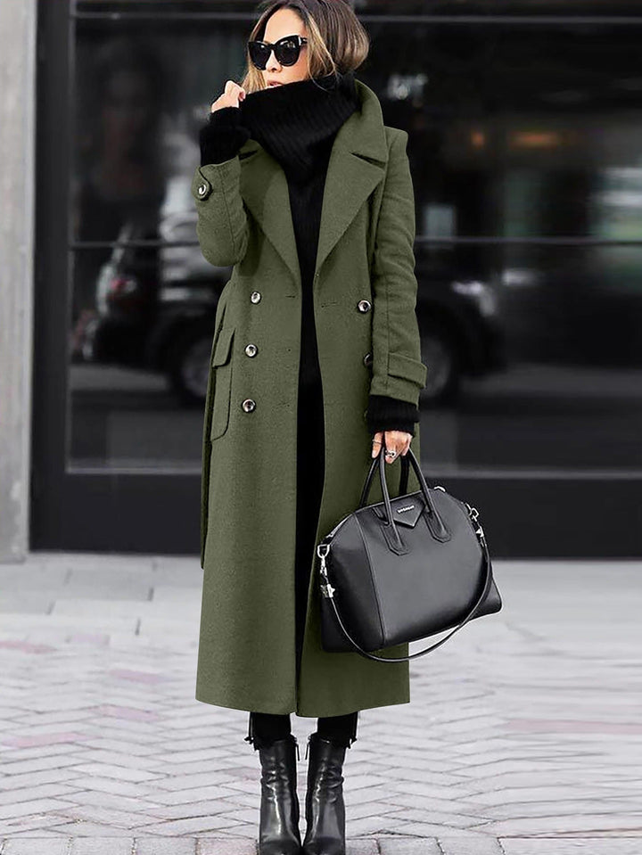 Olive green full length coat styled with a black handbag