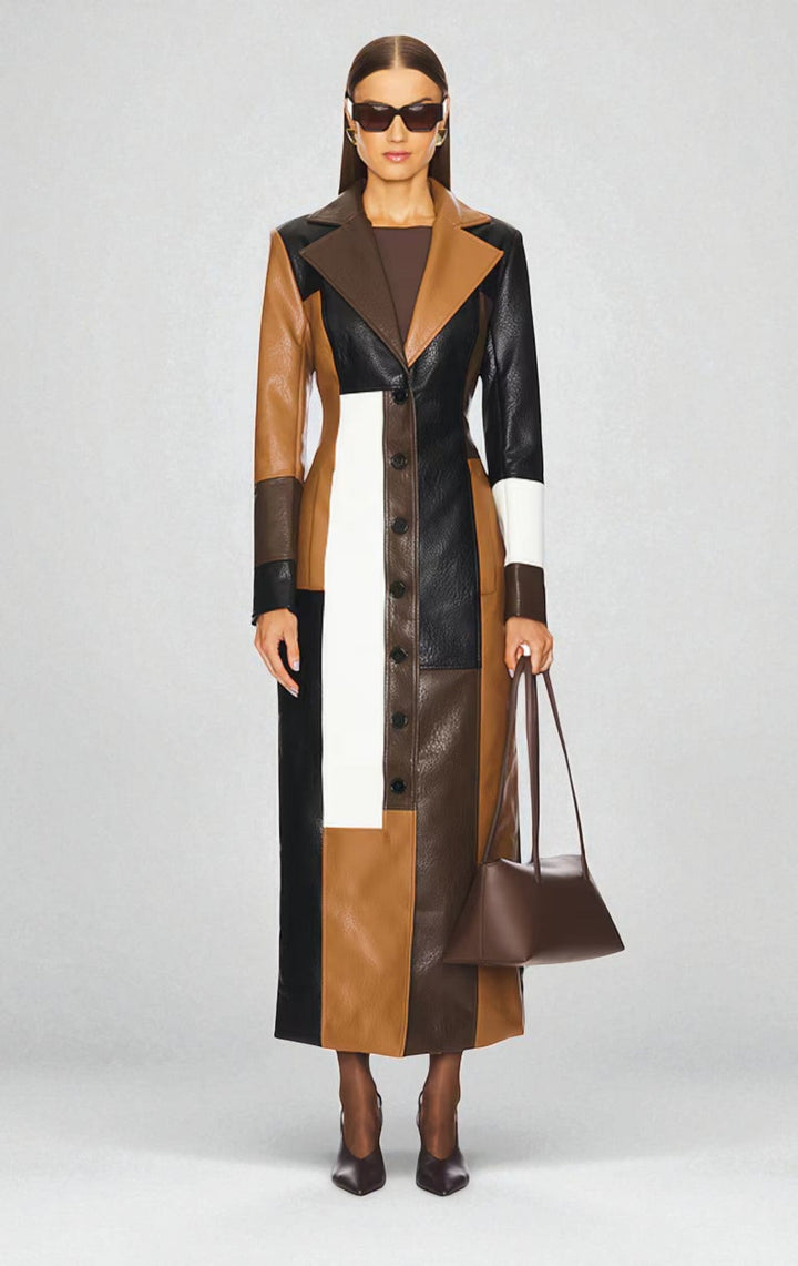 Brown patchwork coat buttoned up, showing tan, black and cream panels