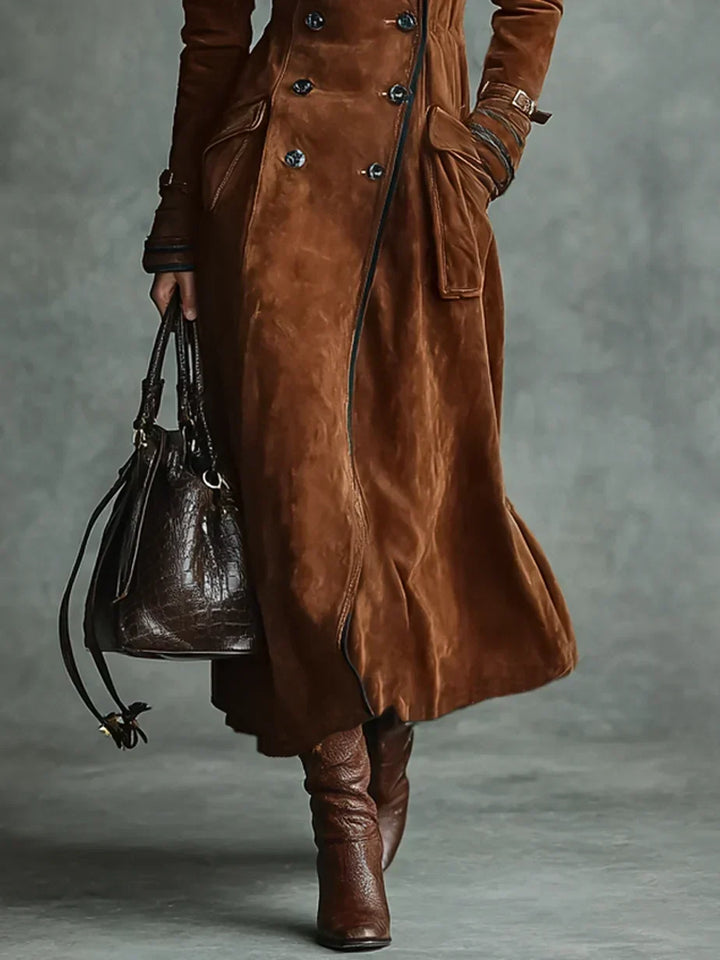 Cognac coat flaring at the hem, worn with knee high boots