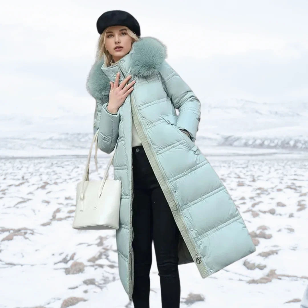 Women's long puffer coat in blue, faux fur hood belted quilted