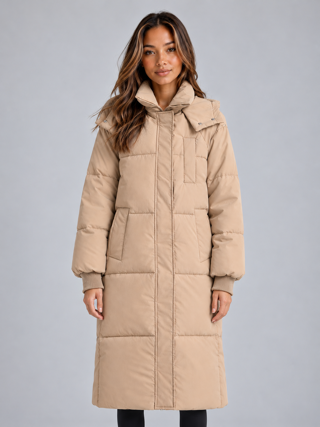 Beige knee length puffer coat with high collar and ribbed cuffs