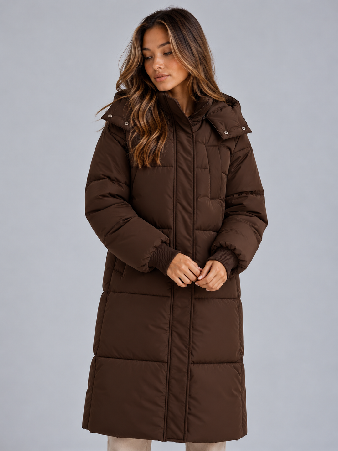 Dark brown long puffer coat with stand collar and snap placket