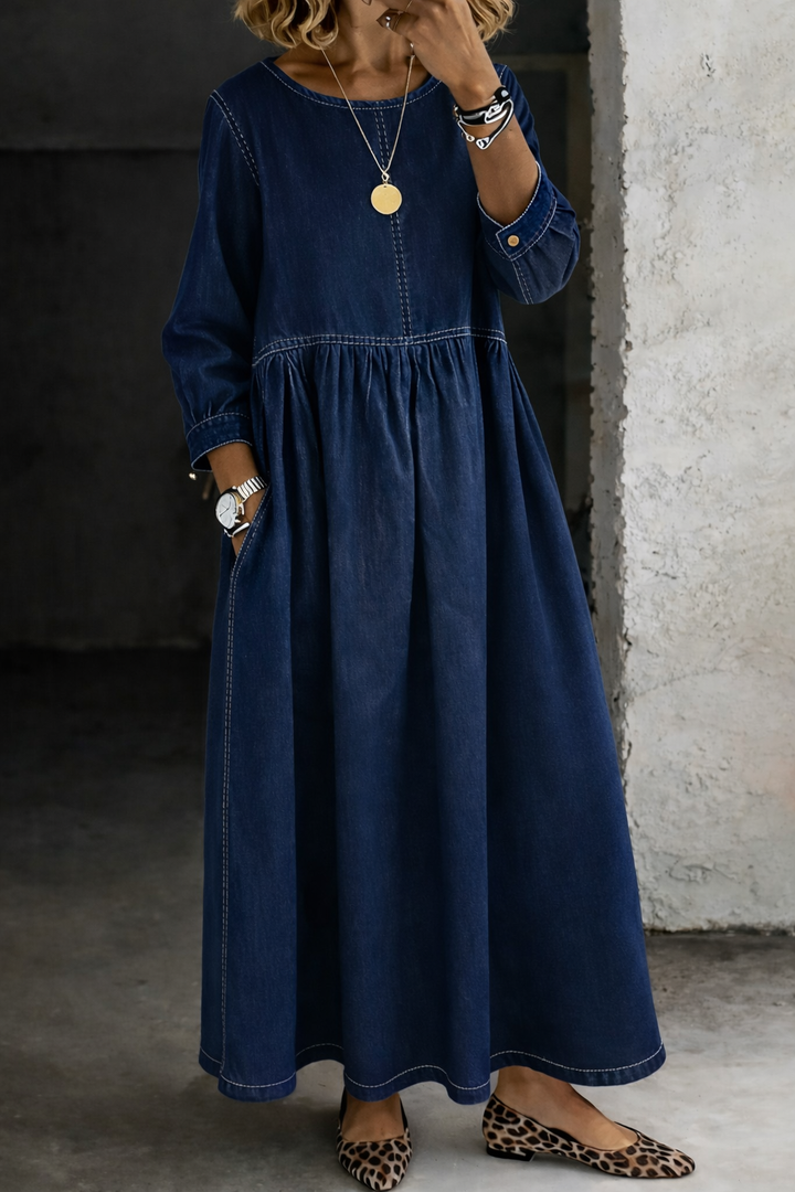 Navy denim-look smock dress with long sleeves, worn with leopard print flats