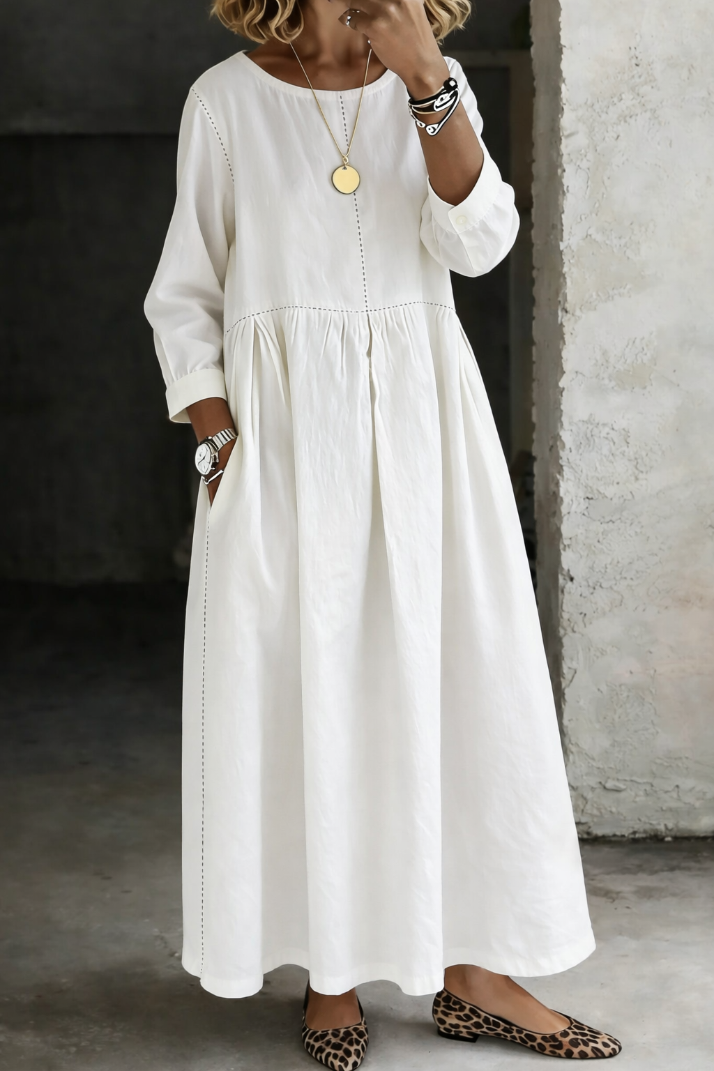 White long sleeve maxi dress with gathered skirt and side pockets