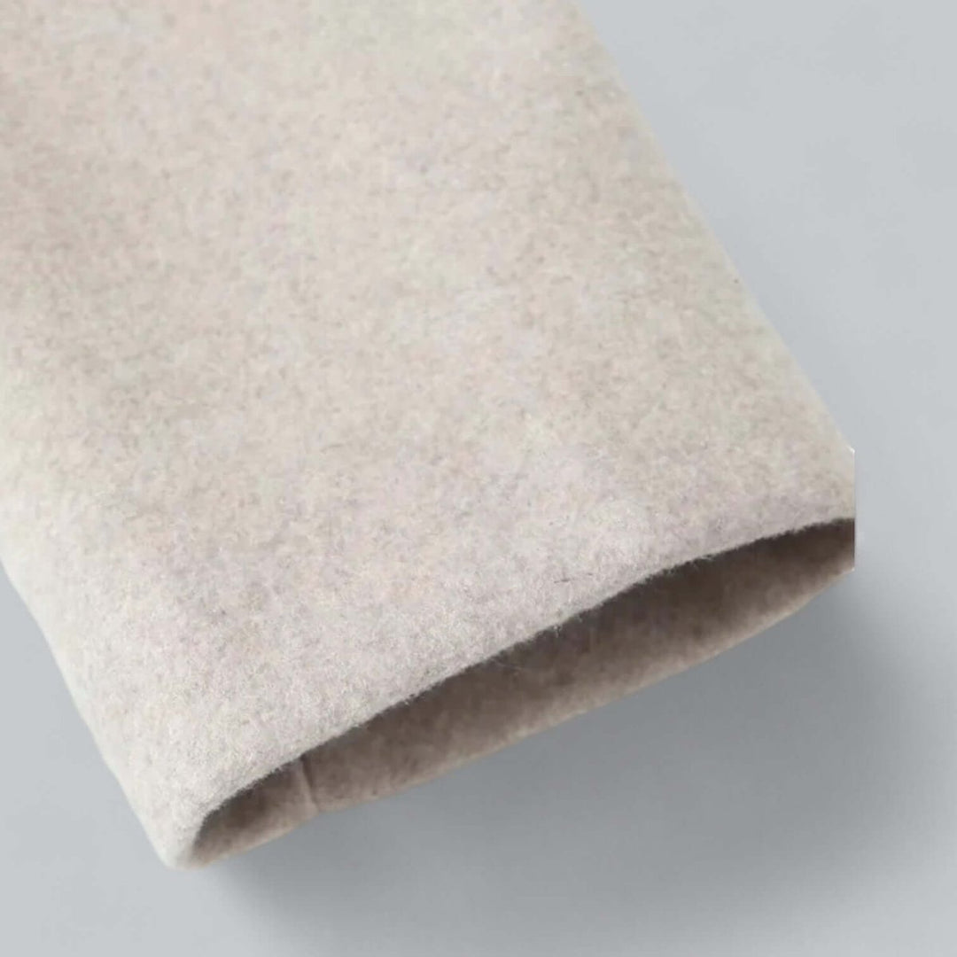 Oatmeal coat sleeve cuff in close up