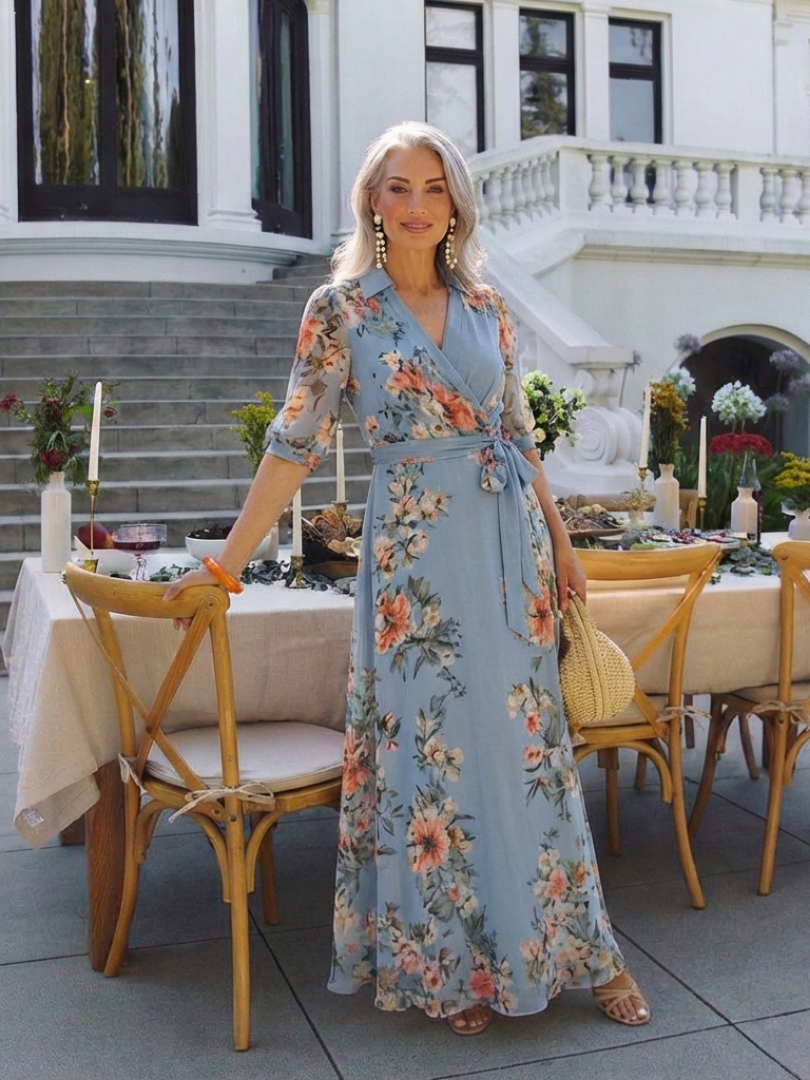 Blue floral dress styled with a straw bag at an outdoor dinner table
