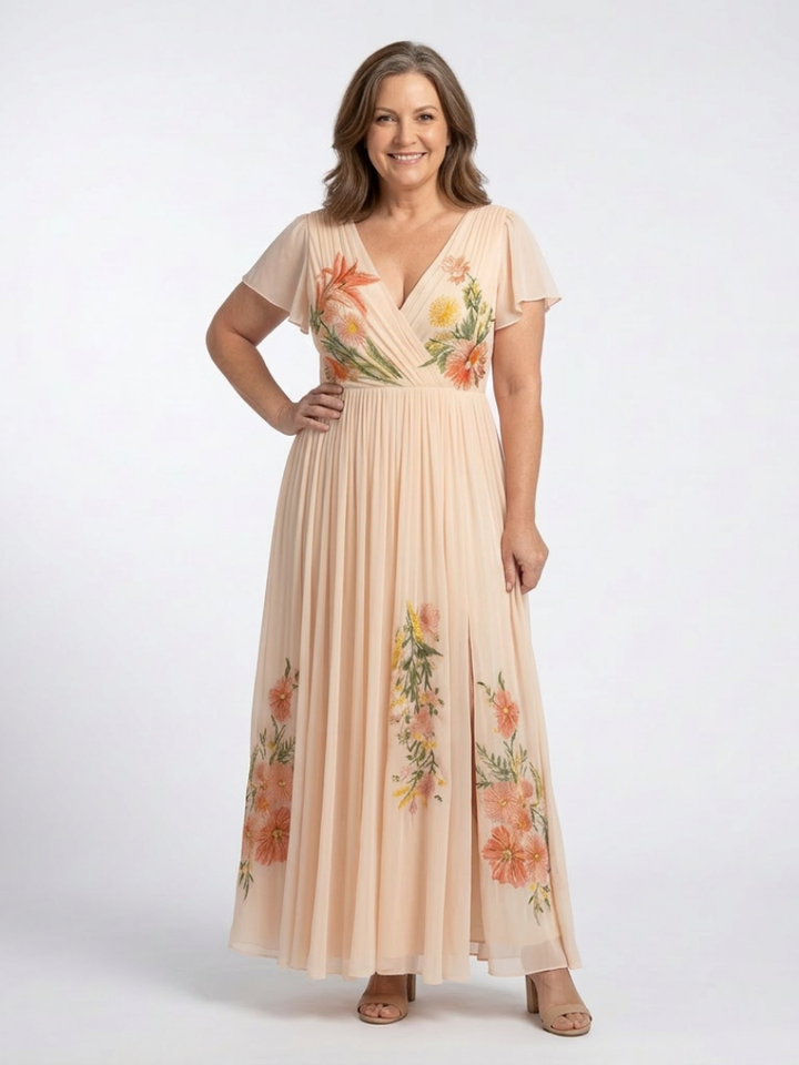 Peach pleated dress with flutter sleeves worn by a curvier model