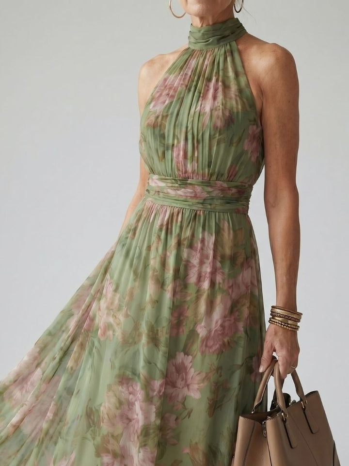 Close up of the gathered halter neckline and wide sash in sage floral