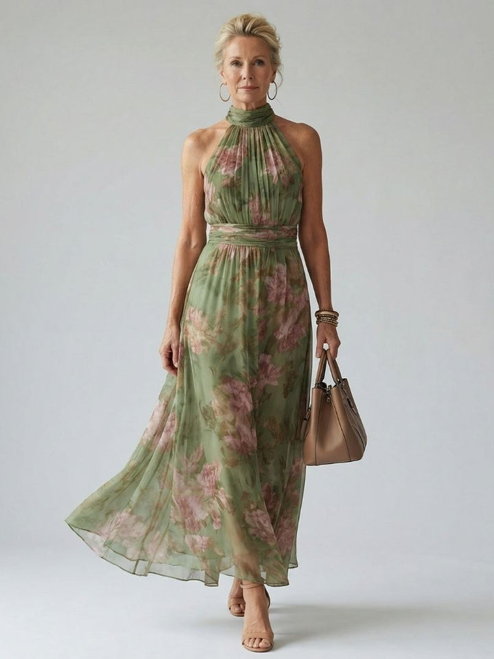 Women's maxi dress in sage green floral with gathered halter neck and sash waist