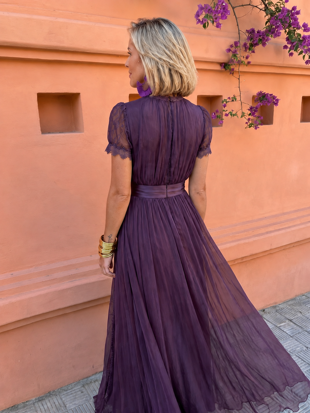 Back view showing the waistband and lace-trimmed sleeves