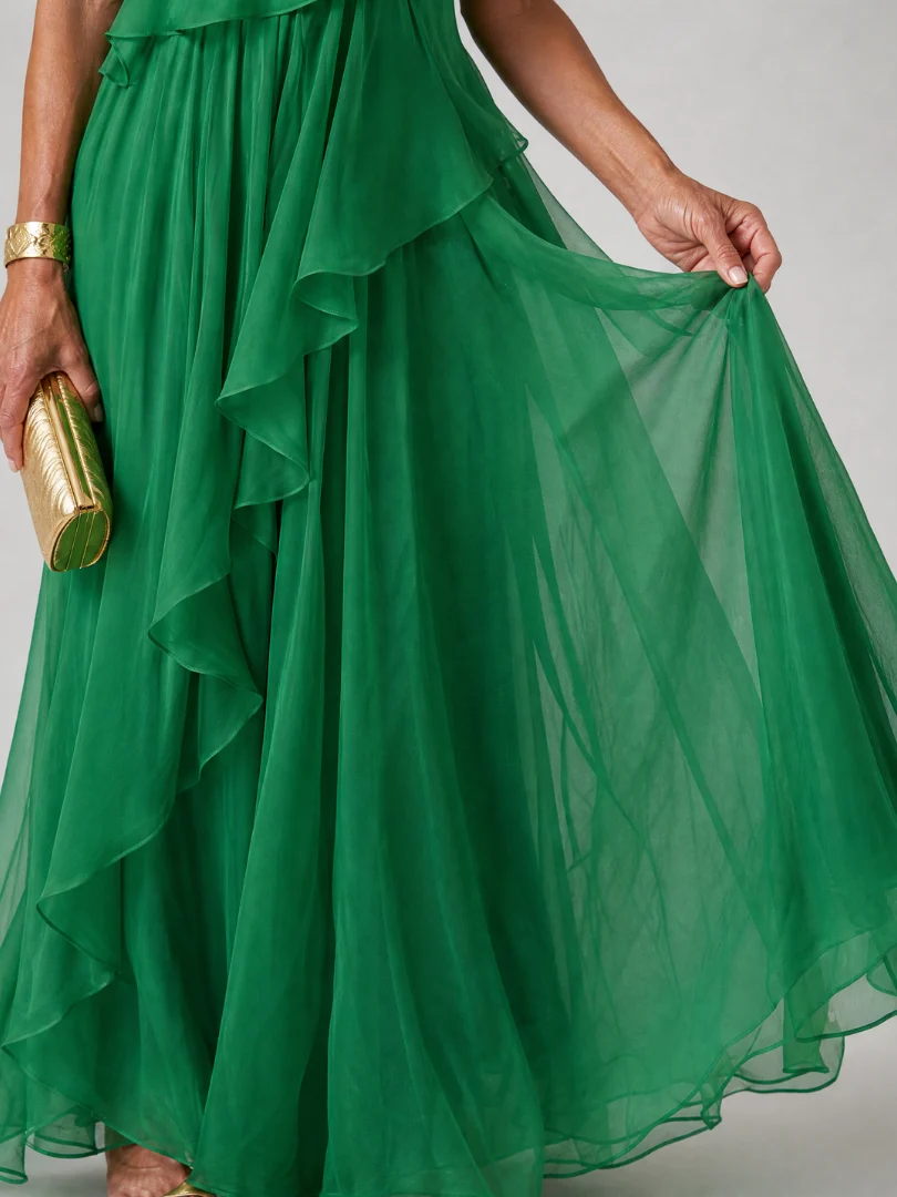 Detail of the airy green skirt layers held out by hand