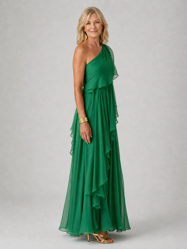 Green dress seen from the side showing the long ruffle line