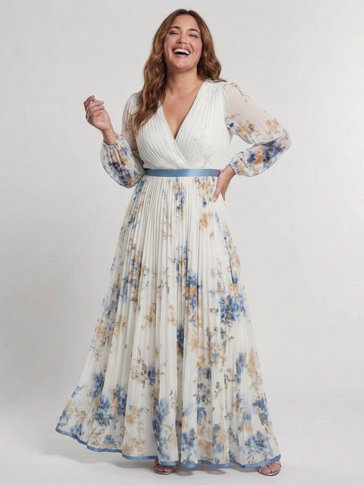 Ivory floral pleated dress worn by a curvier model, smiling