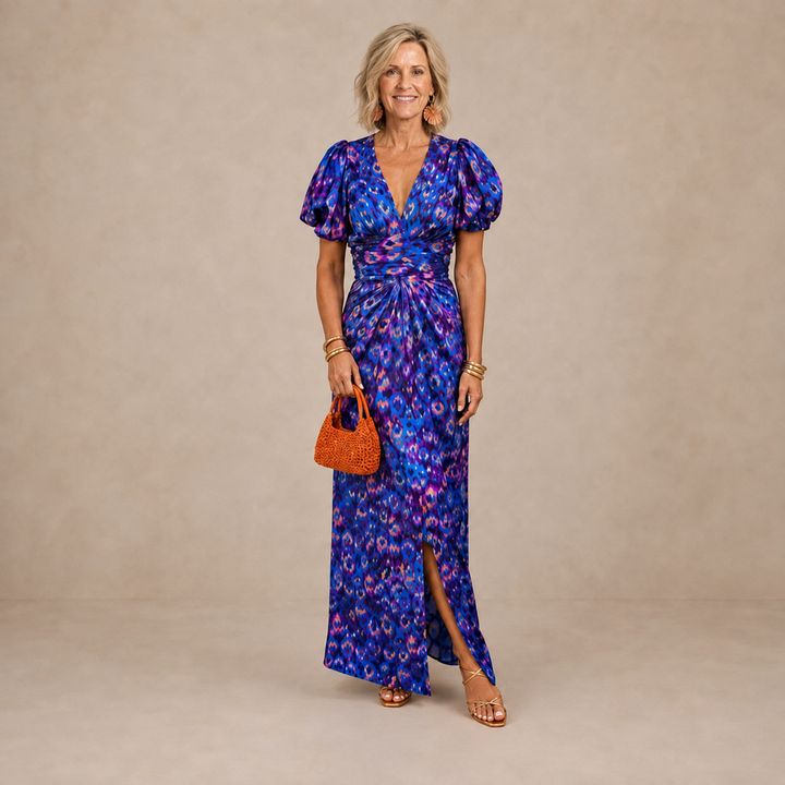 Women's maxi dress in blue print with puff sleeves, ruched waist and front slit