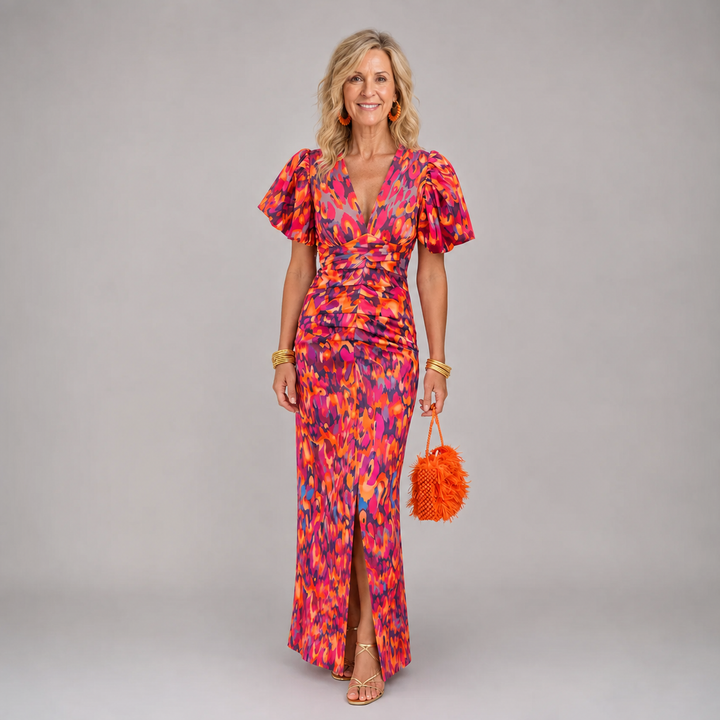 Red and orange print dress with V neckline and gathered waist