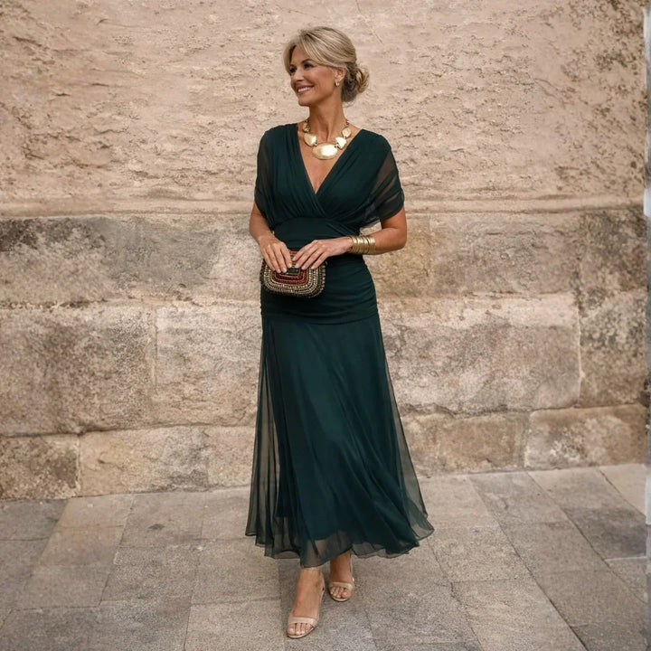 Women's maxi dress in dark green with sheer flutter sleeves, V neckline and tulle skirt