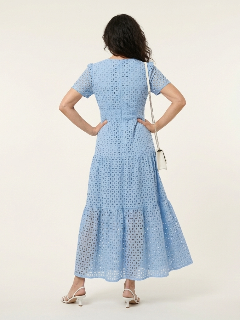 Back view of the sky blue tiered dress with seamed waist