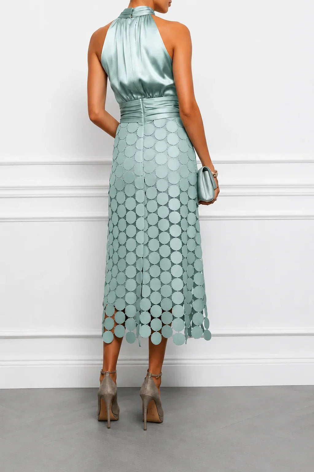 Back view of the aqua dress showing the bare shoulders and appliqué skirt